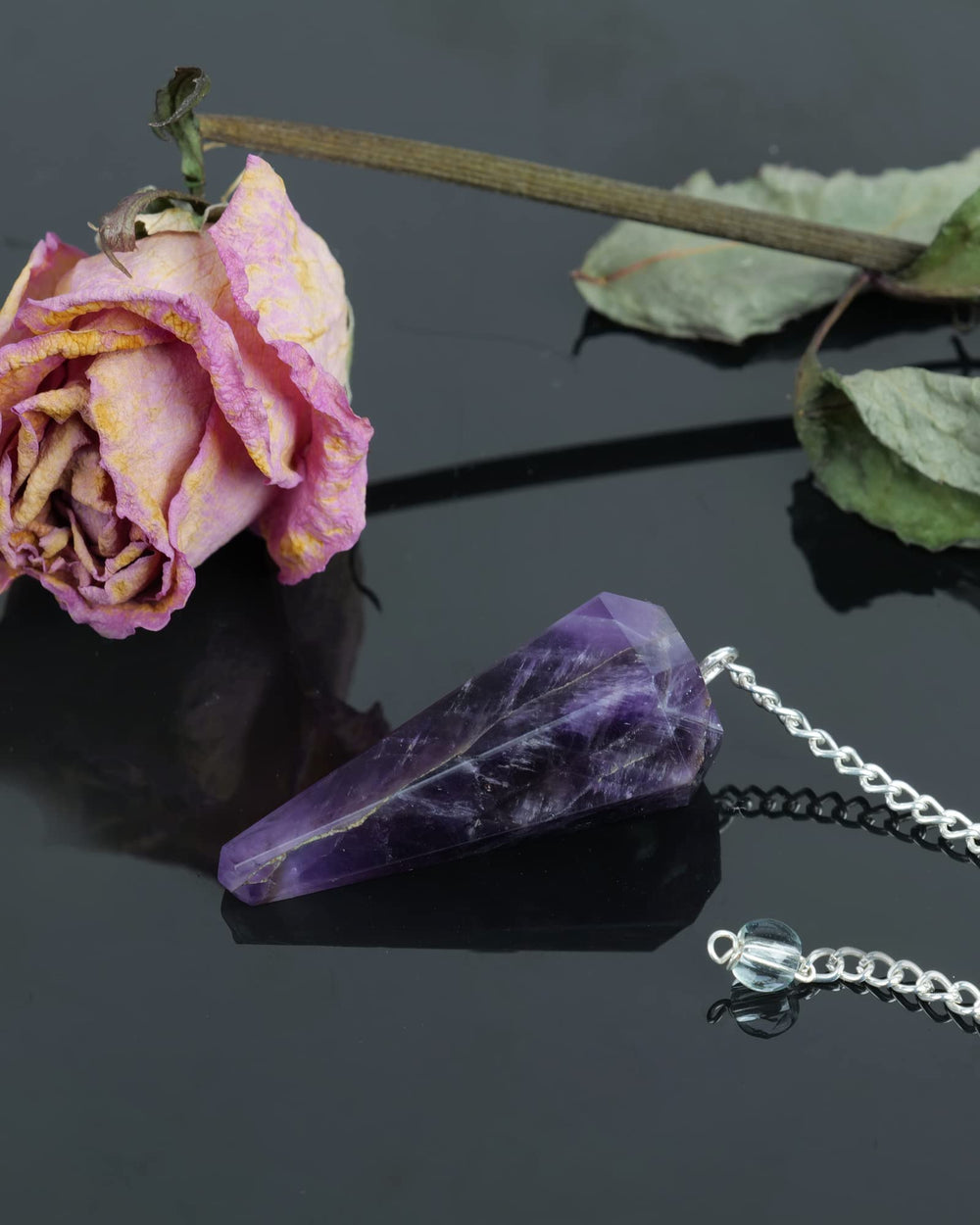 Naribabu amethyst pendulum for on-the-go insight and reflection.