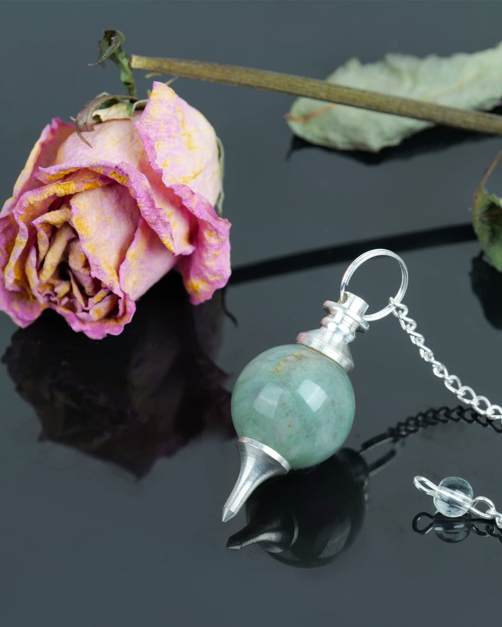 Naribabu display-ready pendulum for home spiritual practice and Reiki routines.