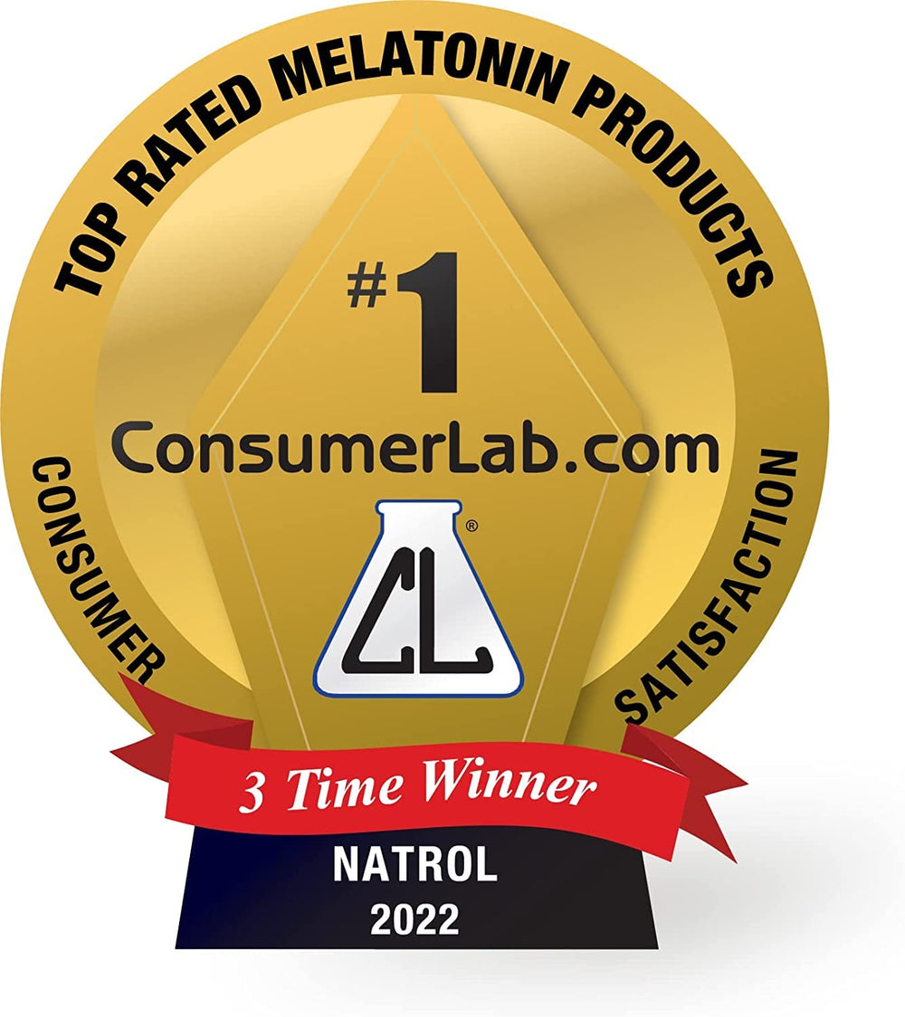 Natrol melatonin on bedside table near pillow