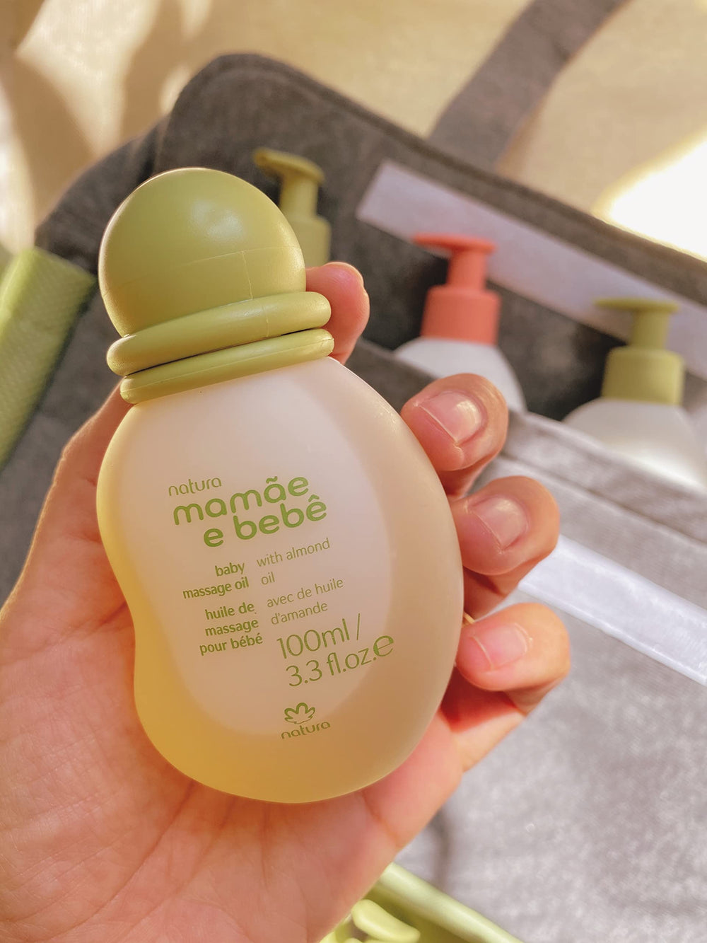 Natura Baby Massage Oil packaging highlights eco-friendly design.