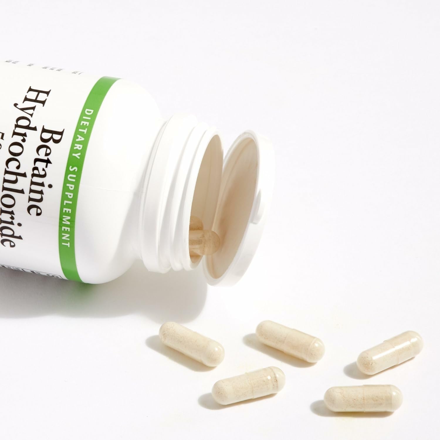 Natural Factors Betaine HCL 500mg capsules closeup for easy swallowing.
