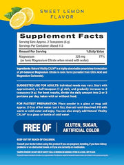 Natural Vitality CALM powder scoop beside the lemon flavor formula.
