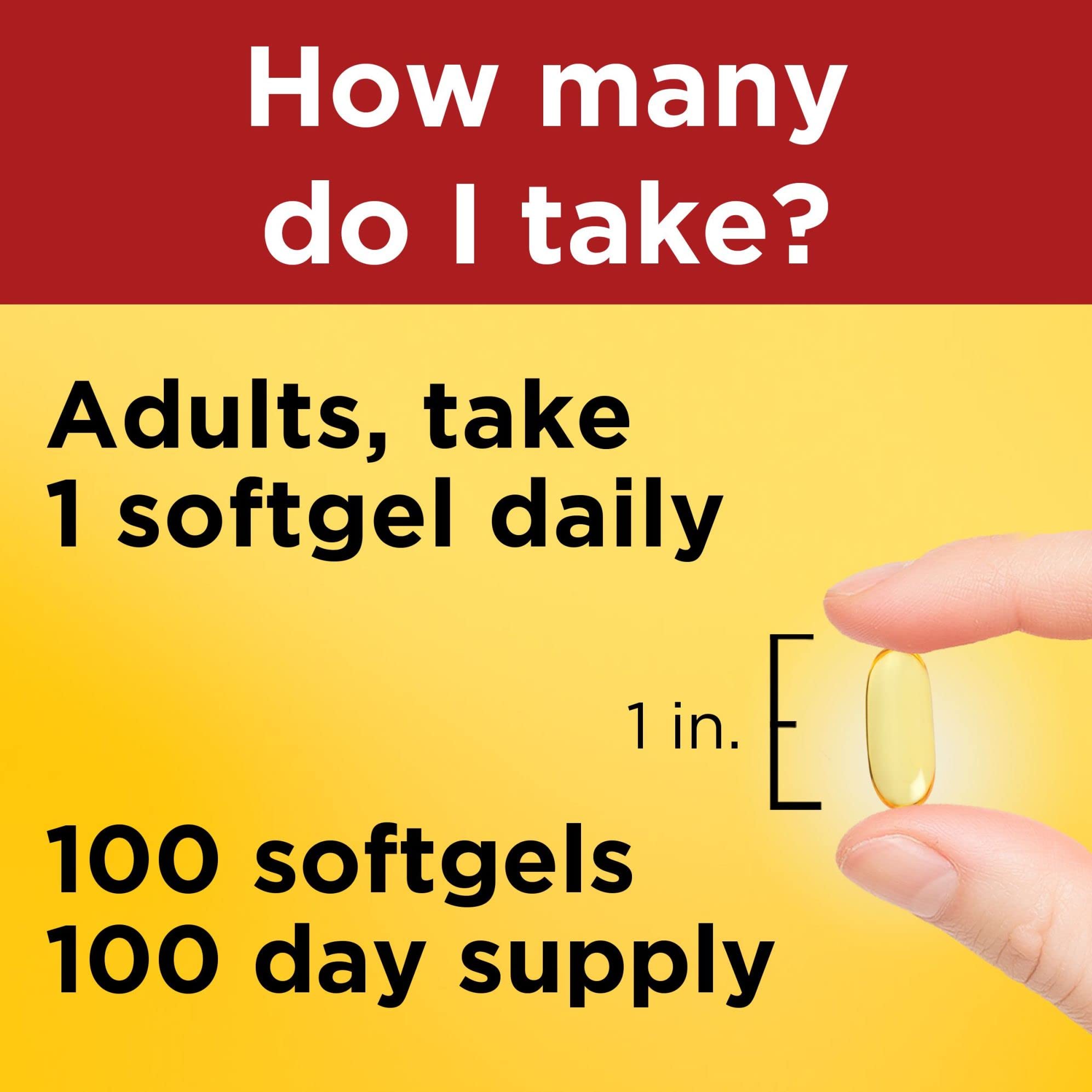 Person takes one Nature Made Omega-3 softgel with water during a meal