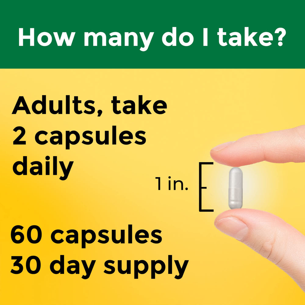 Nature Made magnesium complex capsules next to measuring spoon for daily routine