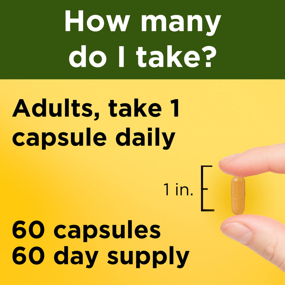 Two Nature Made Turmeric Curcumin 500 mg capsules poured into hand