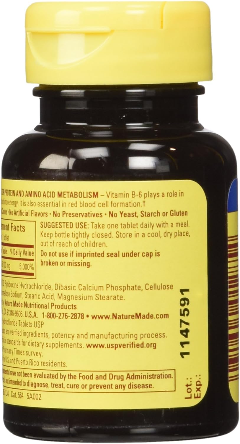 Nature Made Vitamin B-6 tablets in hand for portable daily use