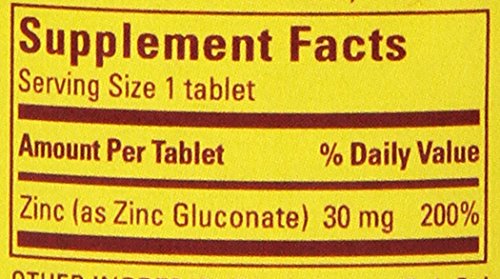 Nature Made Zinc 30mg tablet with glass of water for daily intake