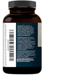 Close-up of NatureBell Magnesium Malate capsules emphasizing digestibility