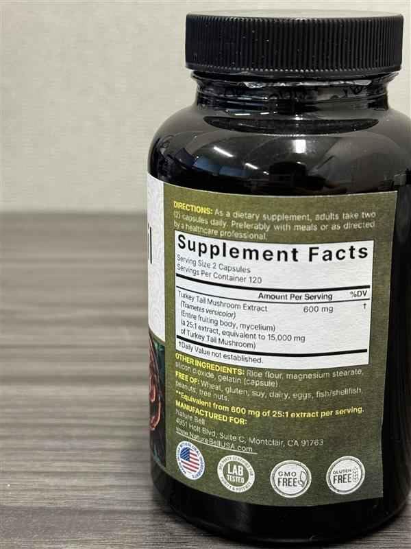 NatureBell Turkey Tail capsule close-up highlights full spectrum extract.