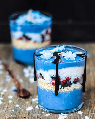 Naturegrail Blue Spirulina powder near a scoop adds color to smoothies.