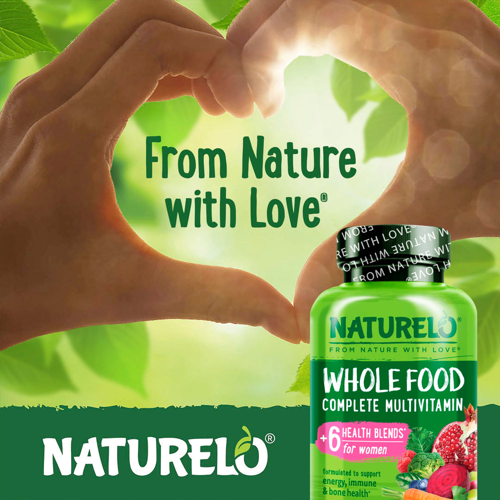 Naturelo Whole Food Multivitamin for Women serving spoon with real-food ingredients