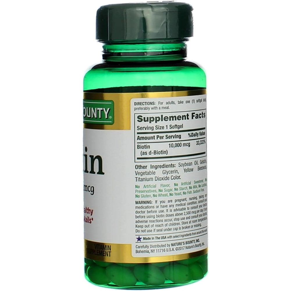 Nature's Bounty Biotin glossy softgel close-up indicates smooth texture and premium formula.