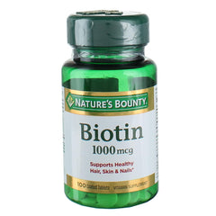 Nature's Bounty Biotin 1000 mcg tablet close-up highlighting metabolism support.
