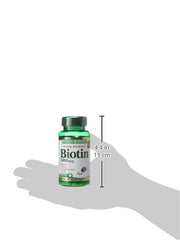 Nature's Bounty Biotin 5000 mcg bottle closeup, easy-to-swallow capsules.