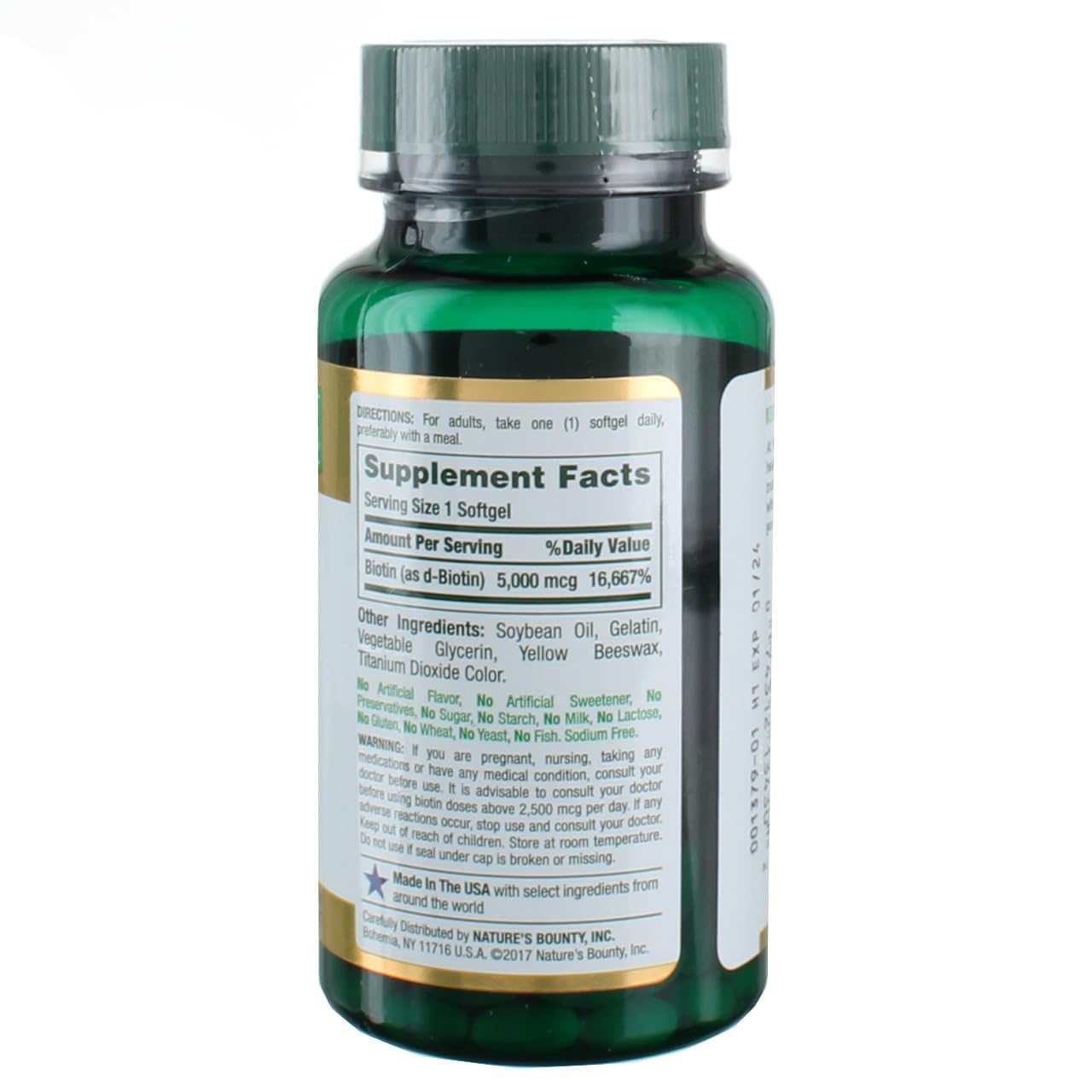 Nature's Bounty Biotin softgels poured from bottle for easy daily use.