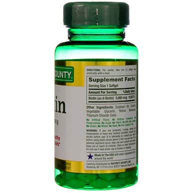 Close-up of glossy Nature's Bounty Biotin softgel surface for quality feel.