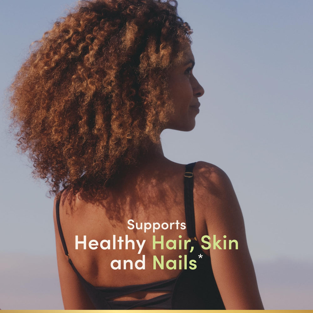 Nature's Bounty Biotin softgels bottle with capsules on clear label emphasizing skin and nail health.