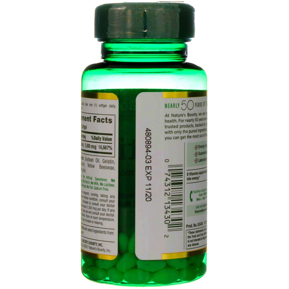 Softgels in hand from Nature's Bounty for easy daily intake.