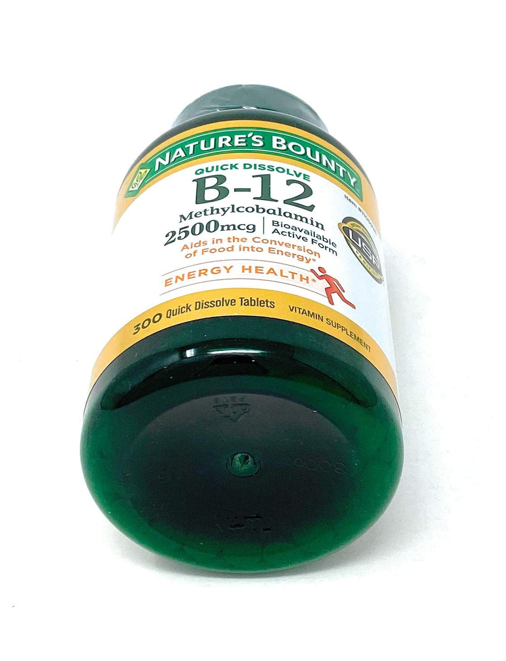 Nature's Bounty bottle of B-12 sublingual tablets on a clean counter.