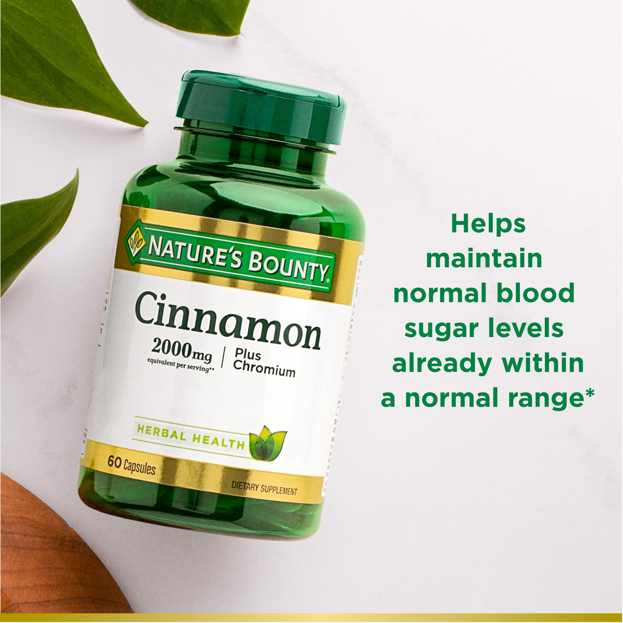 Nature's Bounty Cinnamon 2000mg Plus Chromium capsules being poured with cinnamon sticks