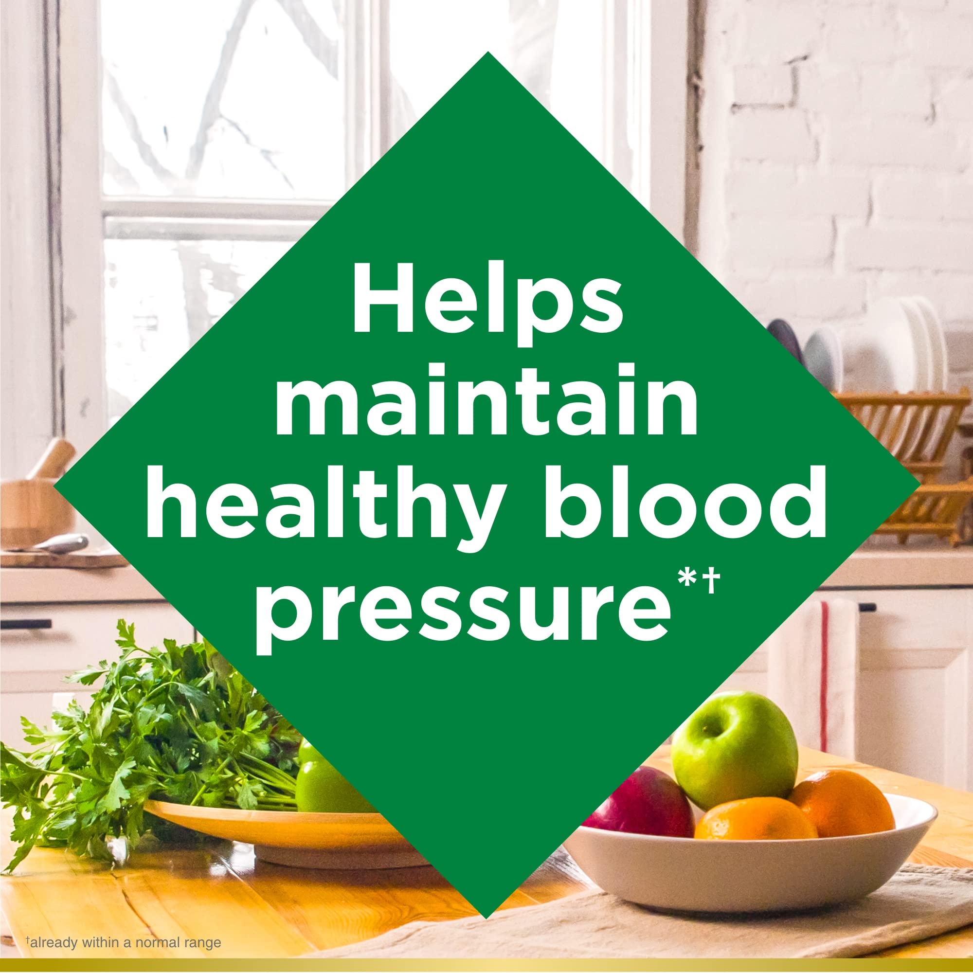 Nature's Bounty CoQ10 bottle beside a glass suggesting daily use for energy support.