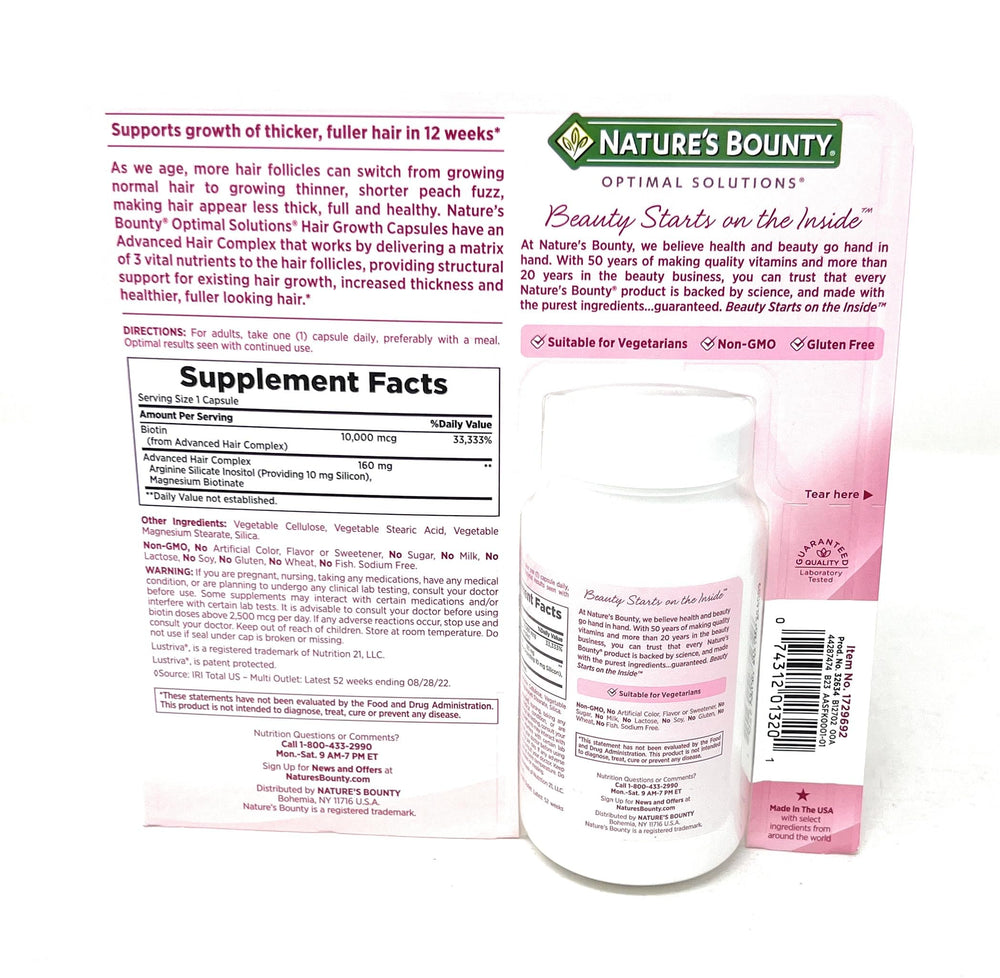 Nature's Bounty Hair Growth bottle label close-up highlights biotin and arginine for hair health.