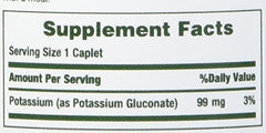Close-up of Nature's Bounty Potassium Gluconate caplets highlighting the veggie capsule