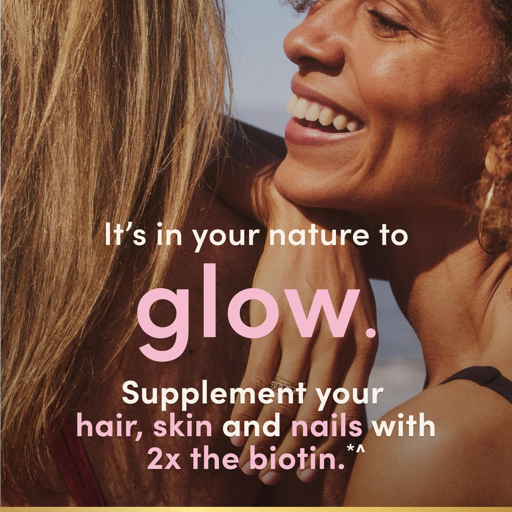User holding bottle of Nature's Bounty capsules for daily beauty routine.