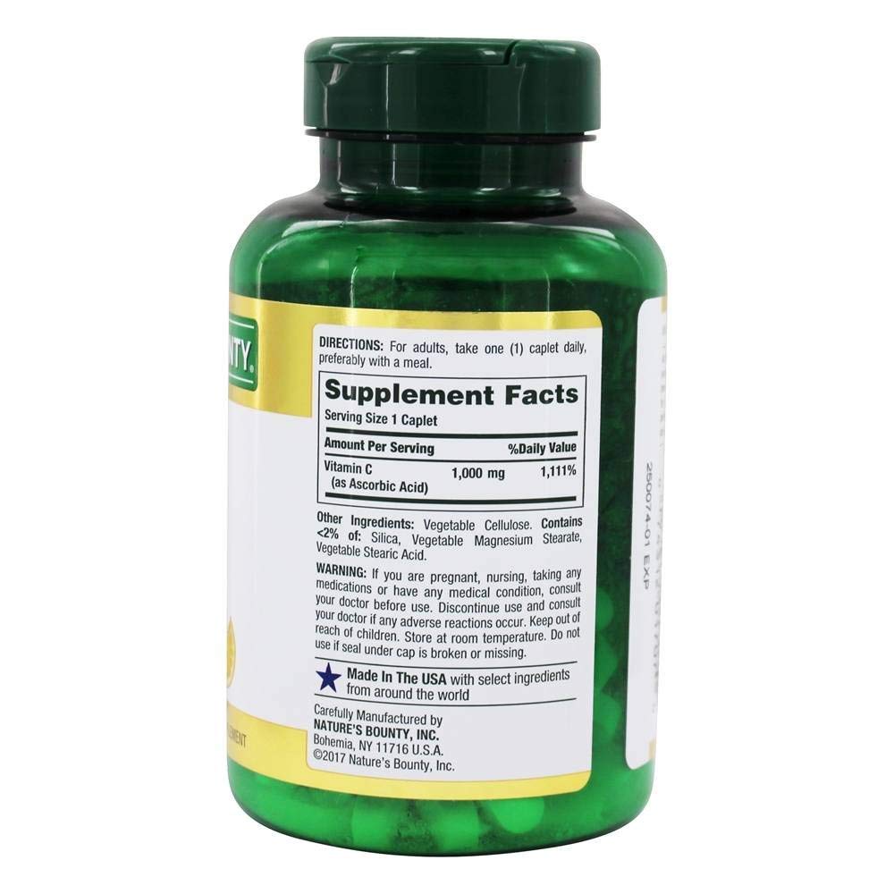 Pouring Nature's Bounty Vitamin C 1000 mg caplets for easy daily use.