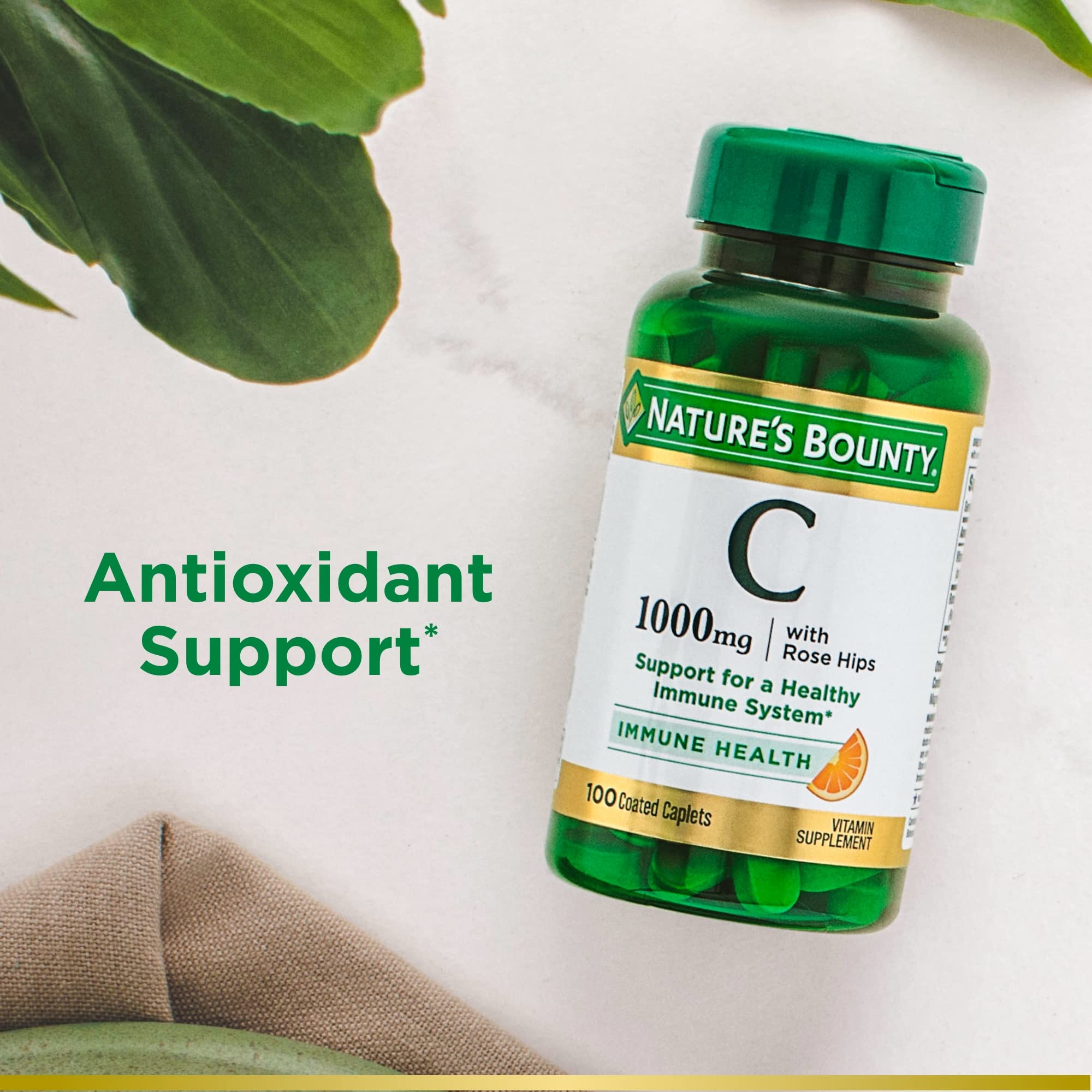Nature's Bounty caplets in hand showing easy daily dose.