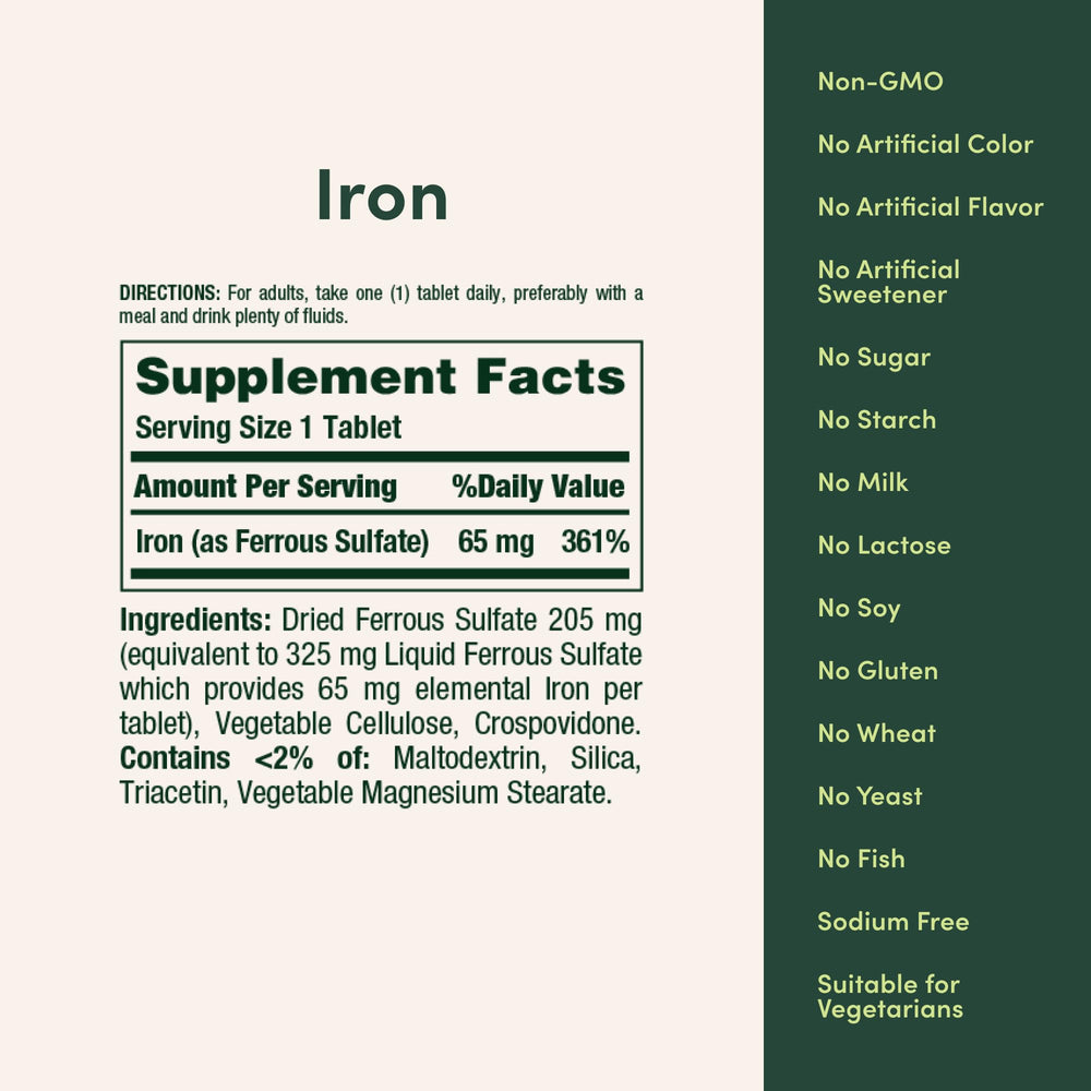 Nature’s Bounty iron tablet in hand; supports daily wellness.