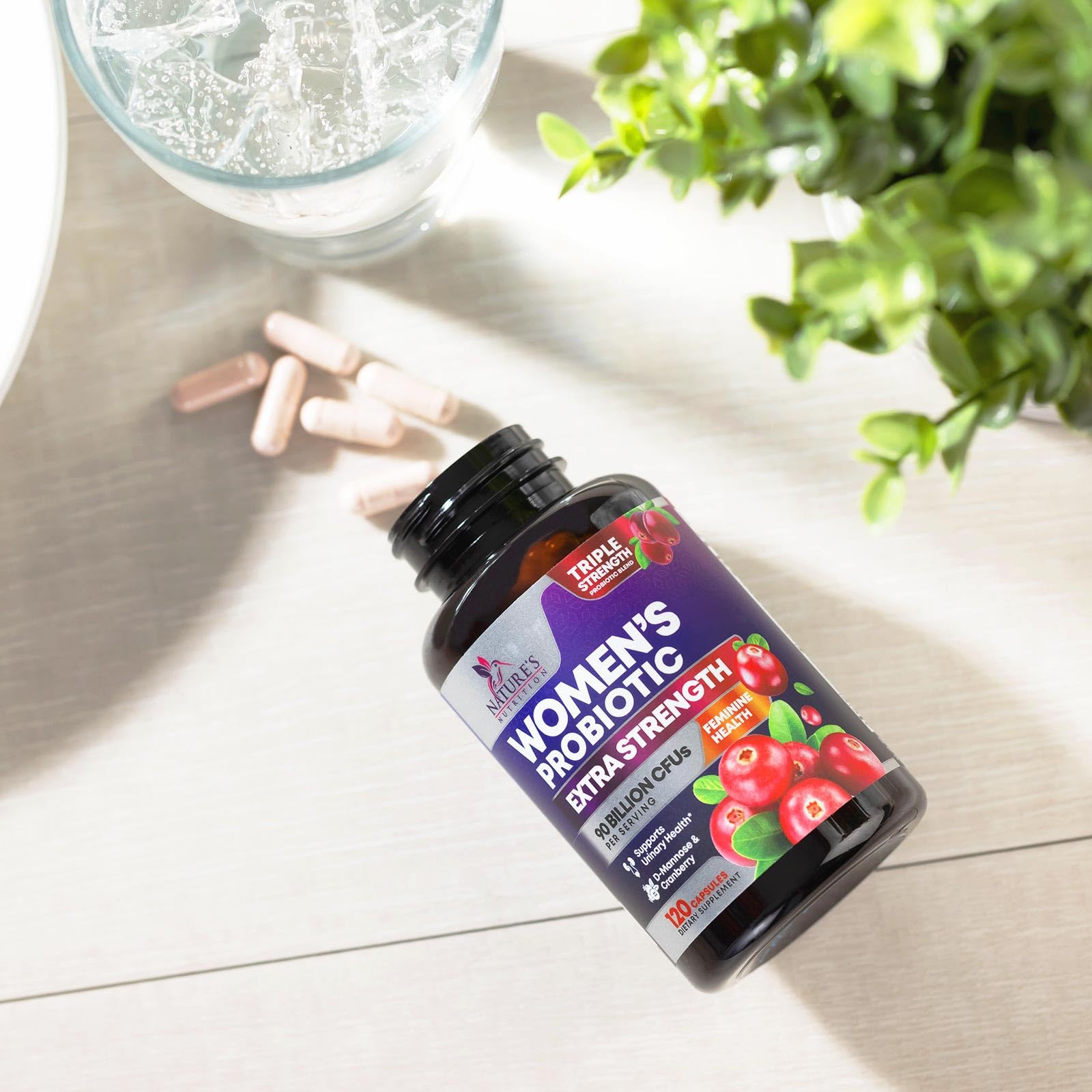 Nature's Nutrition Probiotics for Women daily-use capsules with glass of water