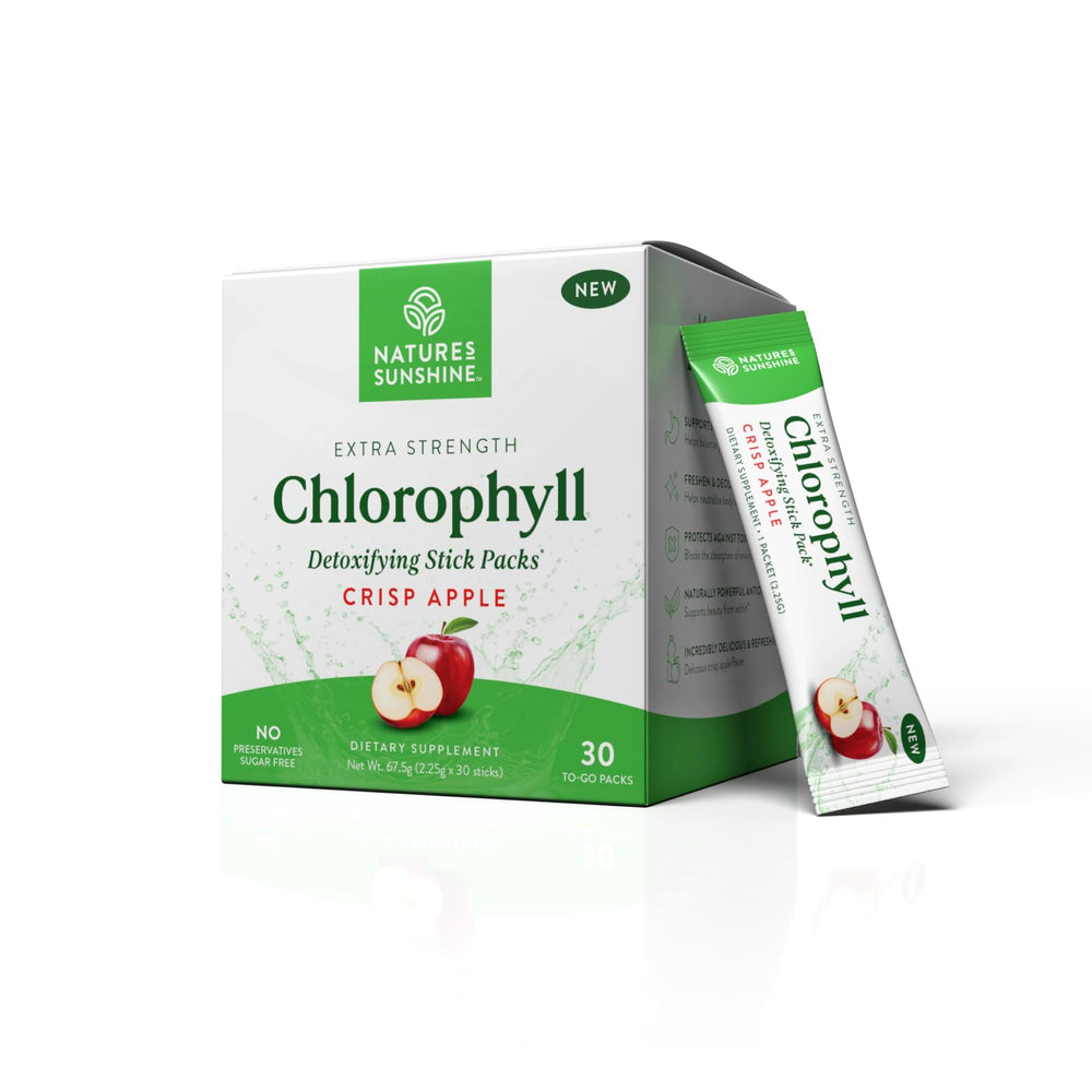 Nature's Sunshine Chlorophyll stick packs with crisp apple in a glass, daily refreshment