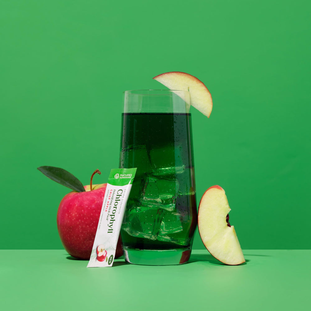 Nature's Sunshine Chlorophyll stick being mixed with water for a refreshing drink