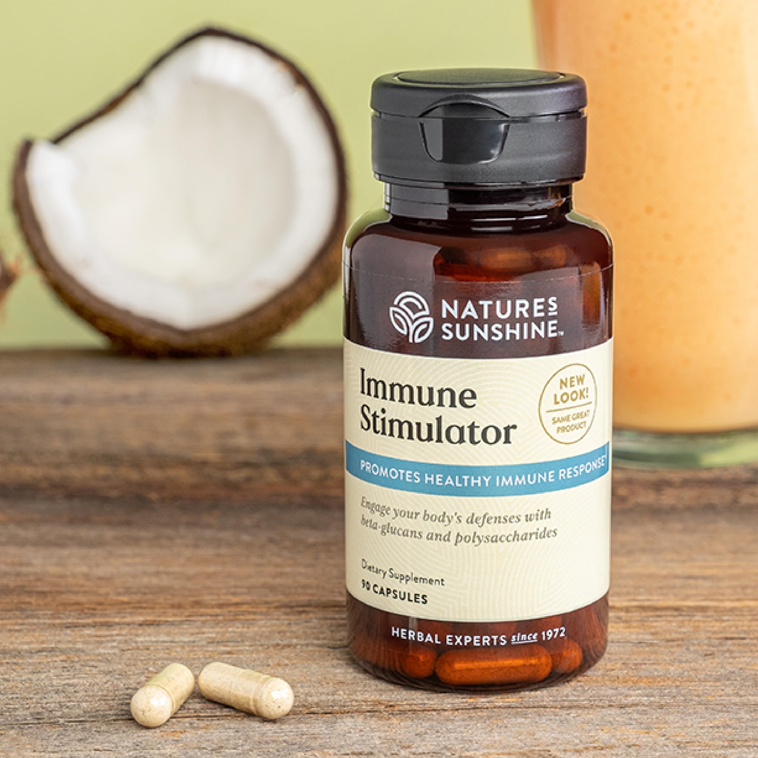 Close-up of Nature's Sunshine Immune Stimulator bottle showing label details.