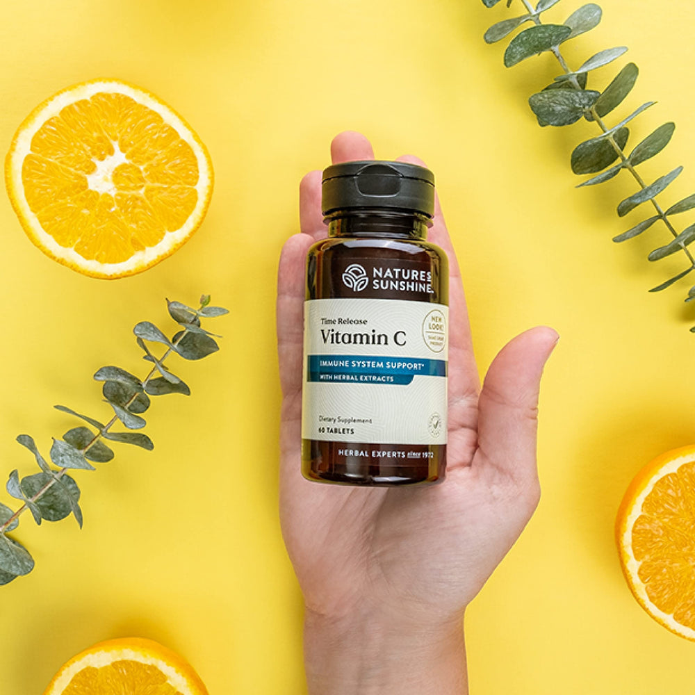 Close-up of Nature's Sunshine Vitamin C Time Release tablet for steady release.