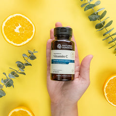 Close-up of Nature's Sunshine Vitamin C Time Release tablet for steady release.