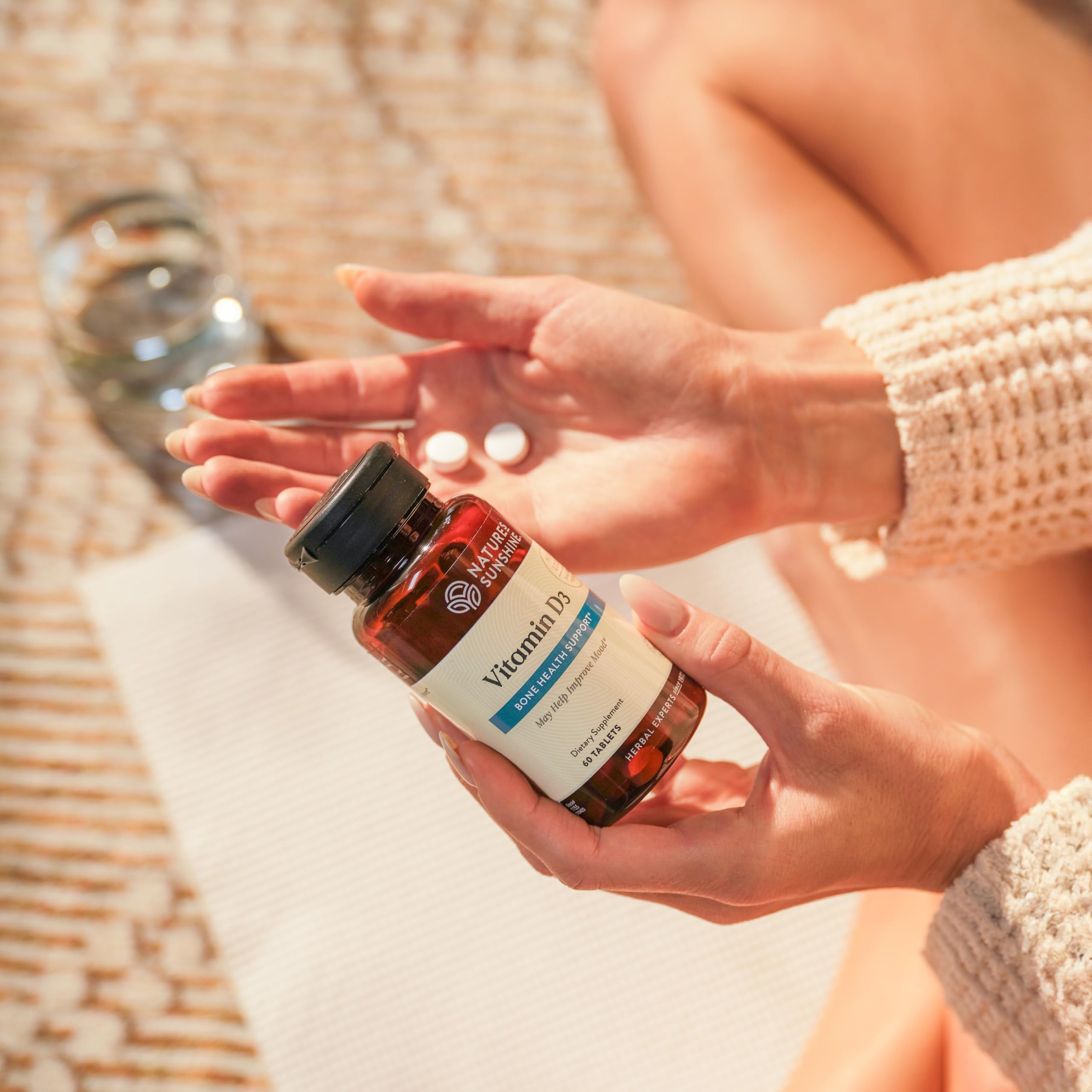 Cap and tablets of Nature's Sunshine Vitamin D3 indicating easy daily dosing