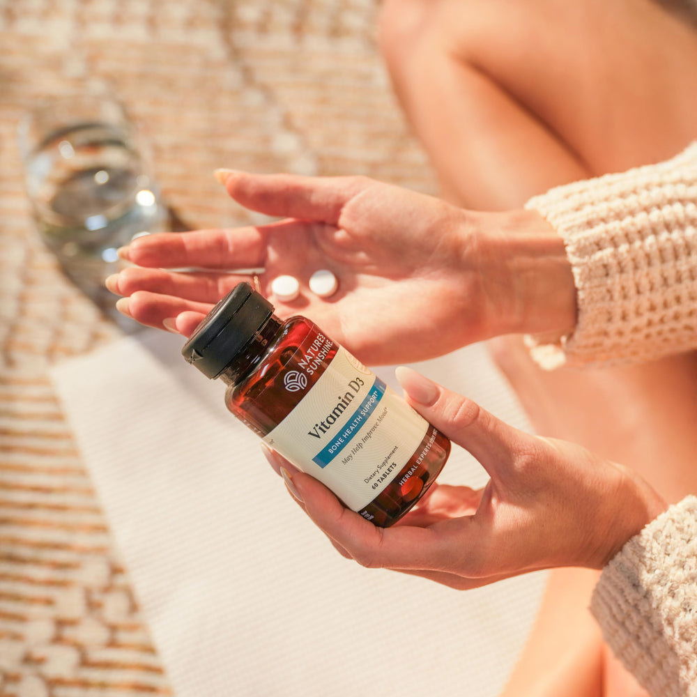 Cap and tablets of Nature's Sunshine Vitamin D3 indicating easy daily dosing