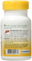 Nature's Way Activated Charcoal capsules close-up showing 560 mg per serving