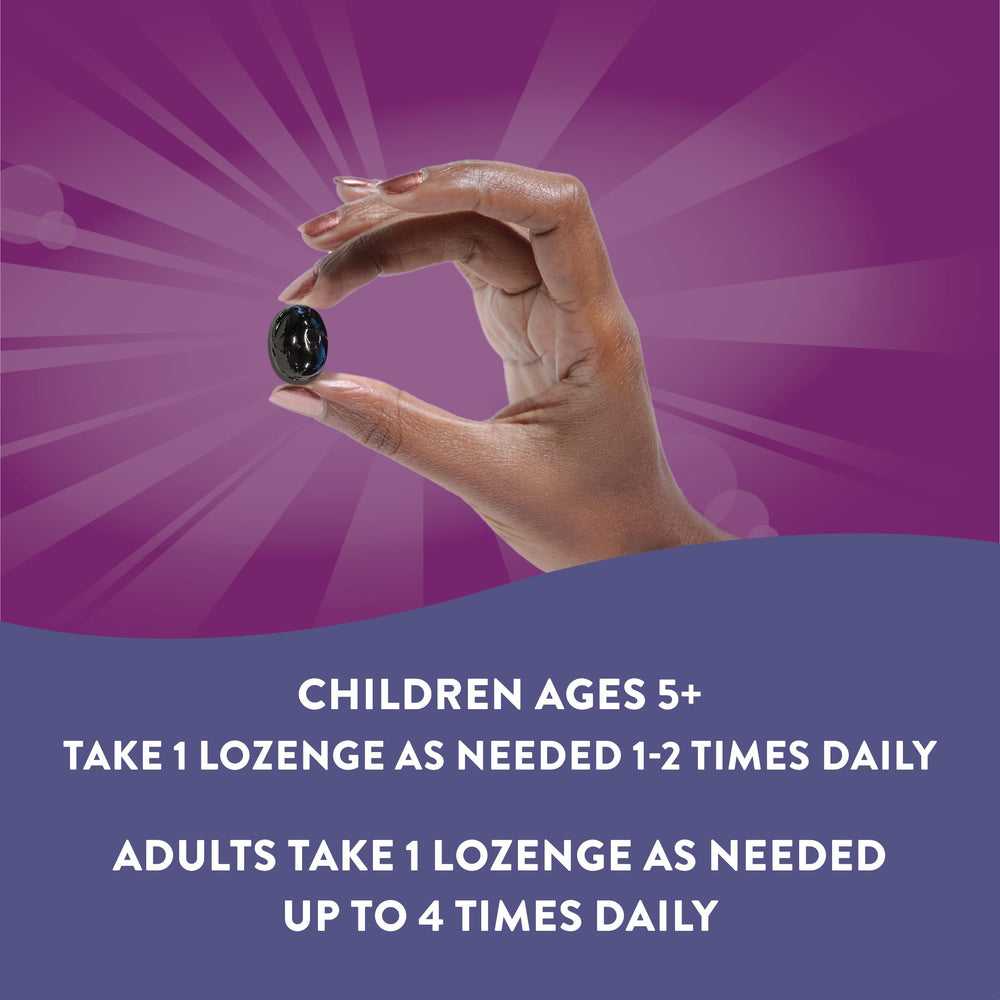 Nature's Way Sambucus Zinc Lozenges consumer hand holding lozenge.
