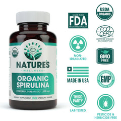 Natures Wellness Spirulina capsules close-up reveals vibrant green color for vegan, gluten-free lifestyles.
