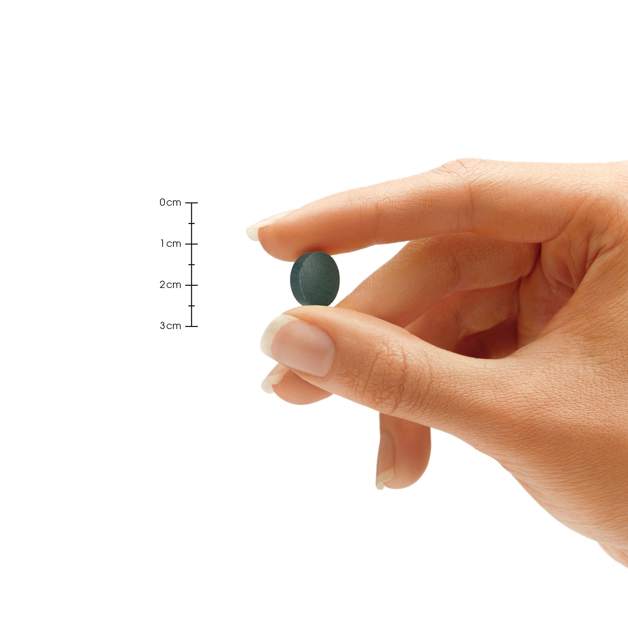 Natures Wellness Spirulina tablet close-up shows 500mg per capsule for precise servings.