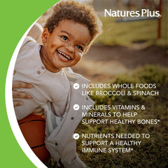 Kids taking NaturesPlus Animal Parade grape tablets during breakfast routine
