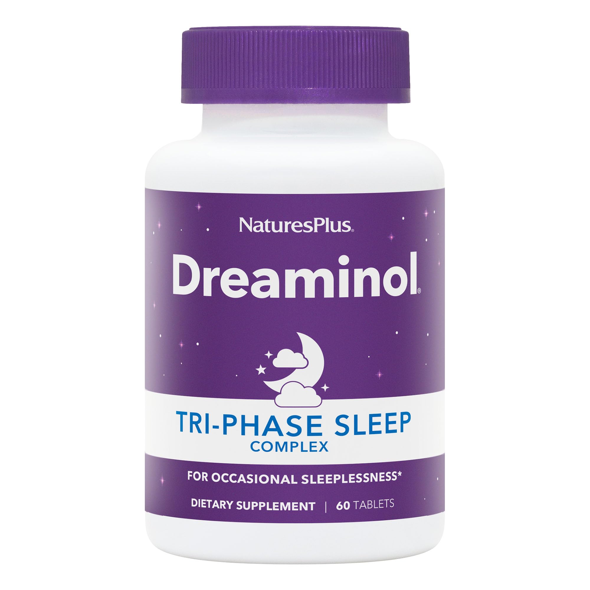 NaturesPlus DREAMINOL Tri-Phase Sleep Complex bottle on a nightstand for calmer bedtimes.