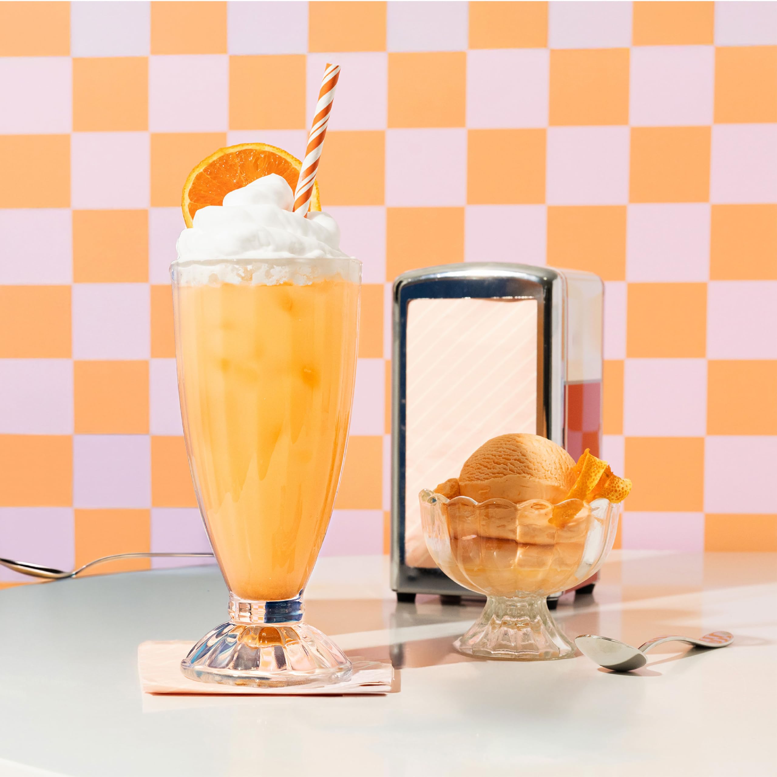 Nello orange creamsicle powder scoop ready for a flavorful daily ritual.