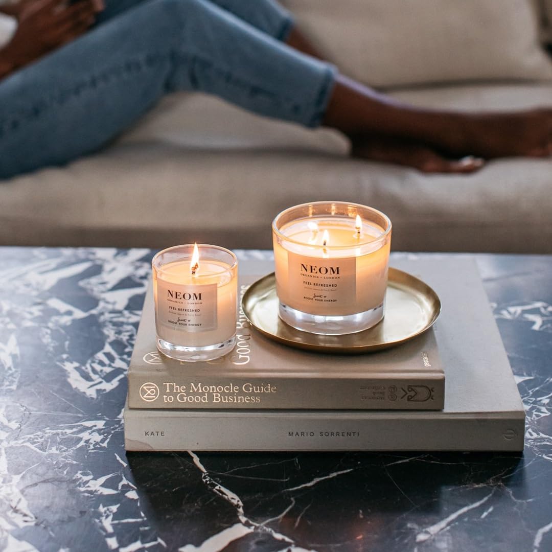 Neom Feel Refreshed candle on desk scene for small workspace use