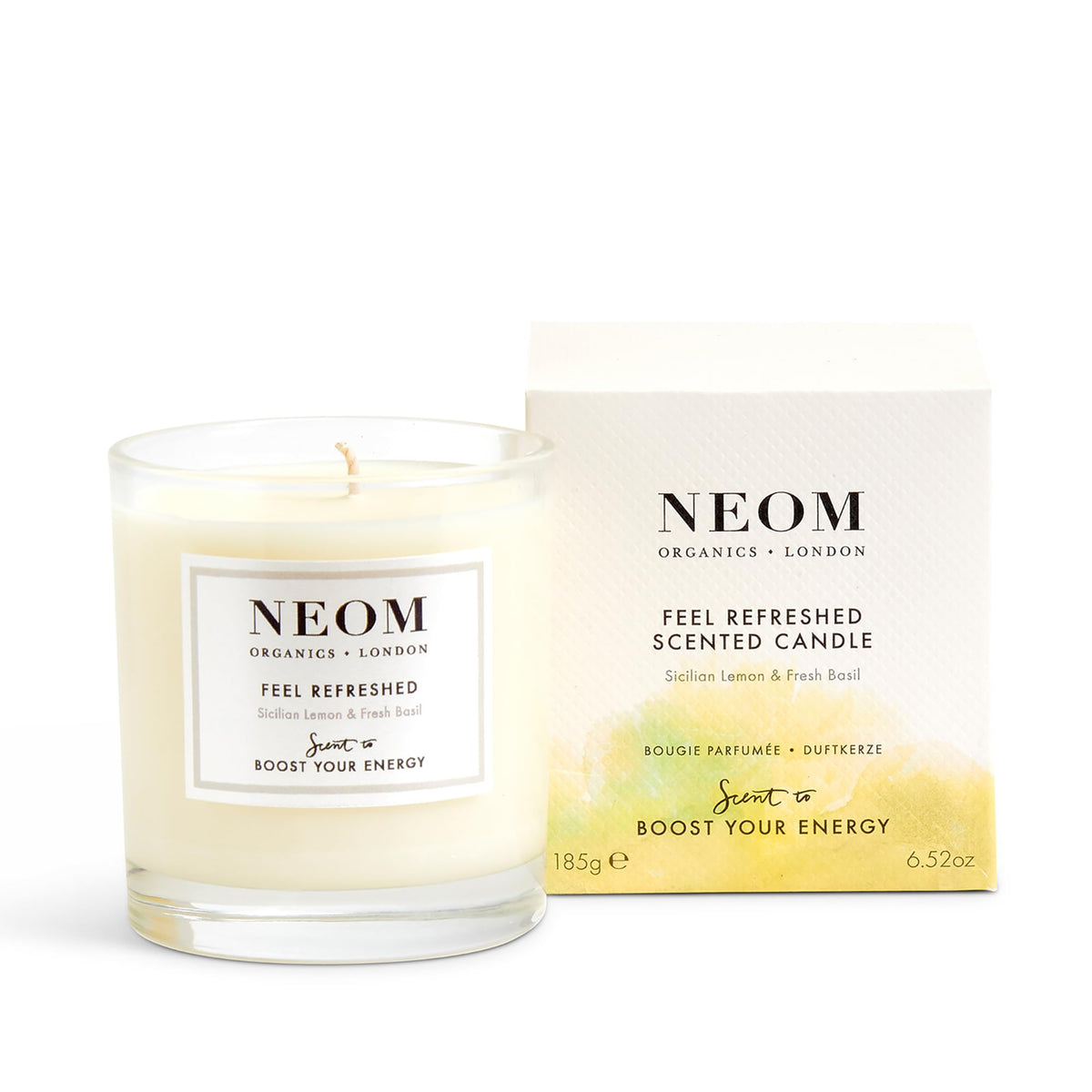 Neom Feel Refreshed candle closeup highlighting lemon and basil aroma for focus