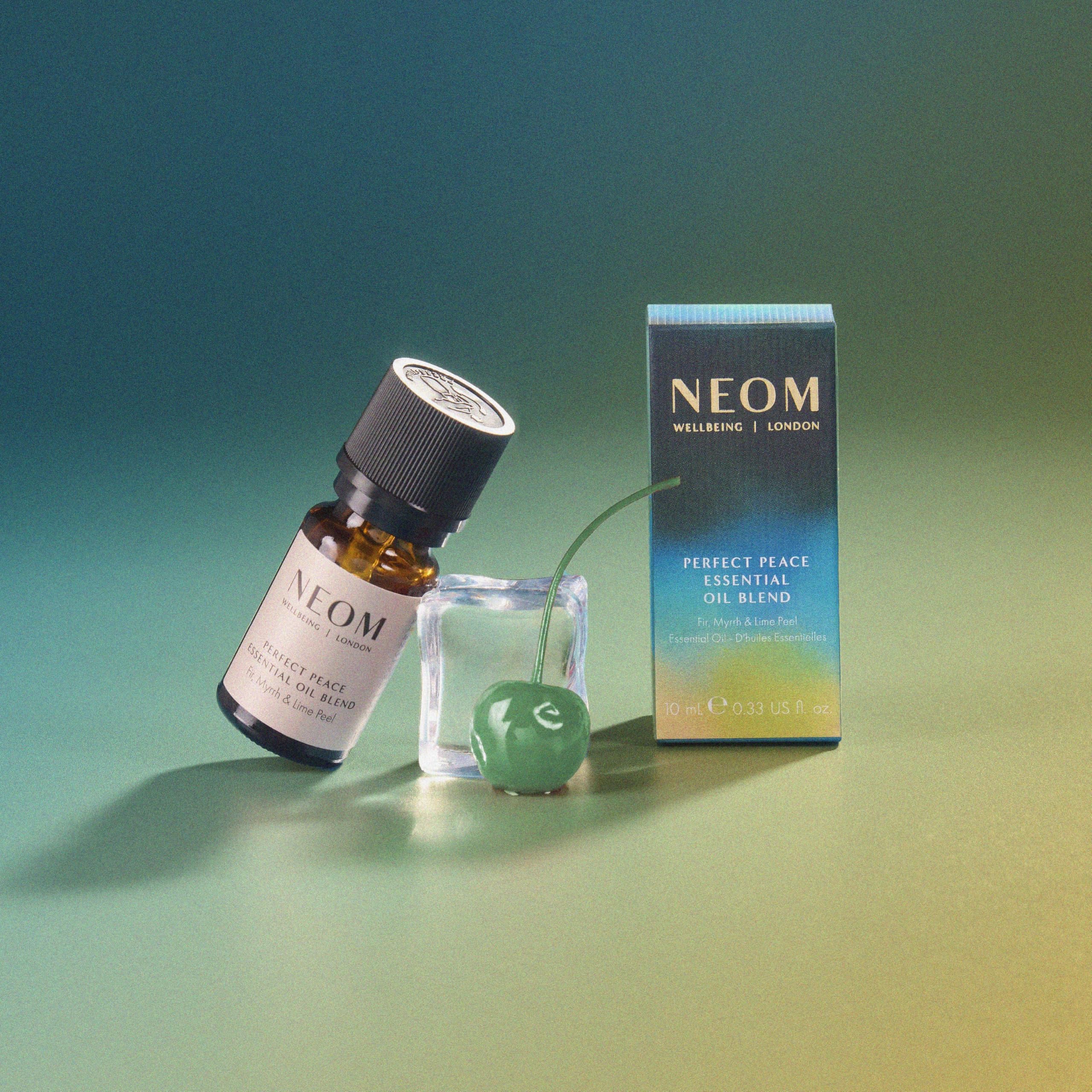 NEOM Perfect Peace bath drops creating serene soaking experience.
