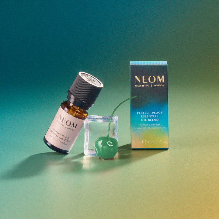 NEOM Perfect Peace bath drops creating serene soaking experience.